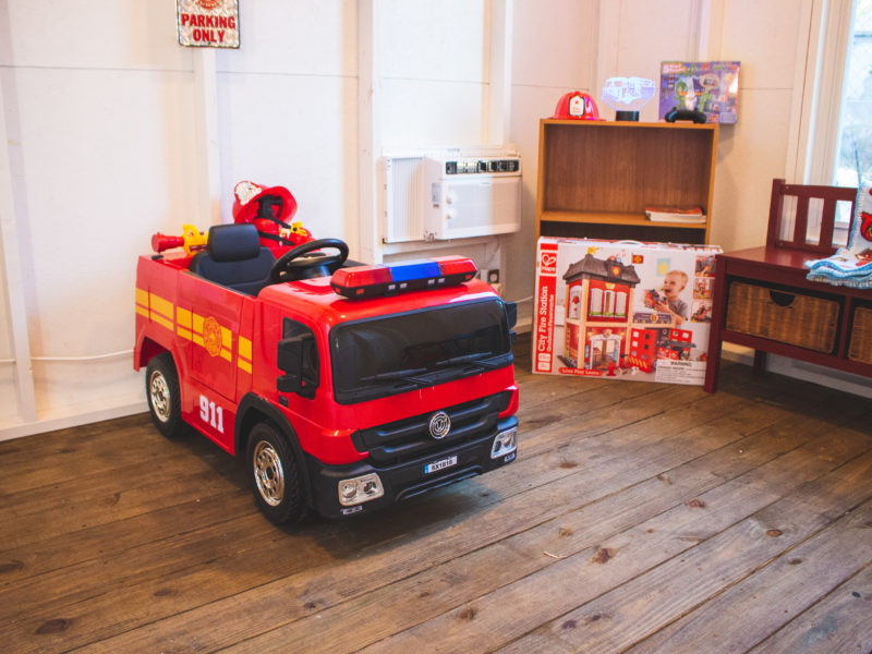 fire truck ride on toy inside playhouse made by WishTo Play